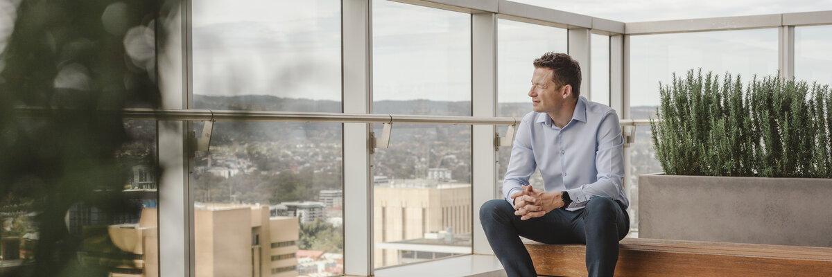 Ben Smart on a rooftop terrace overlooking the city – the perspective of a senior operations partner