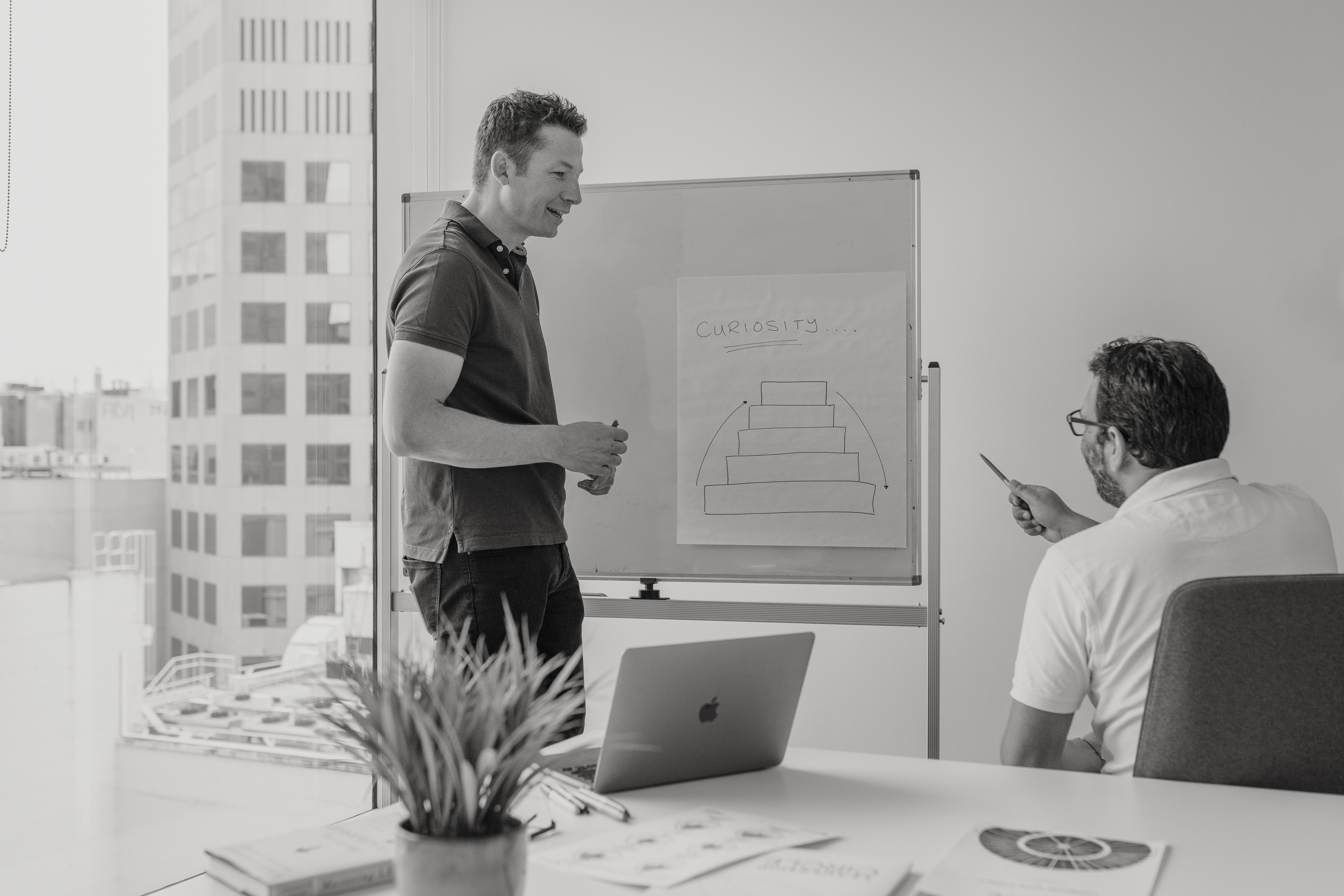 Ben Smart working with a client at a whiteboard during a coaching session